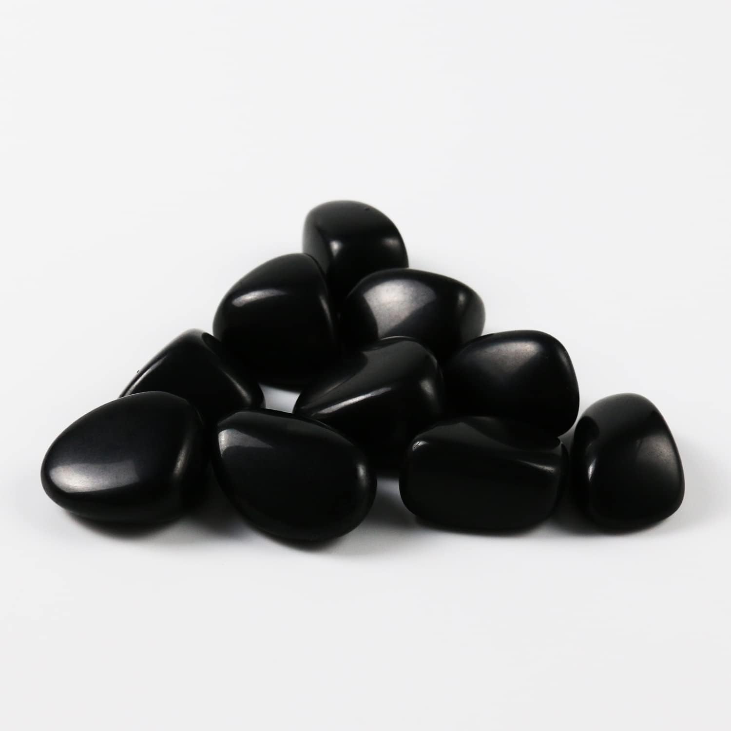 High-polish black obsidian tumbled stones for Feng Shui protection and root chakra grounding
